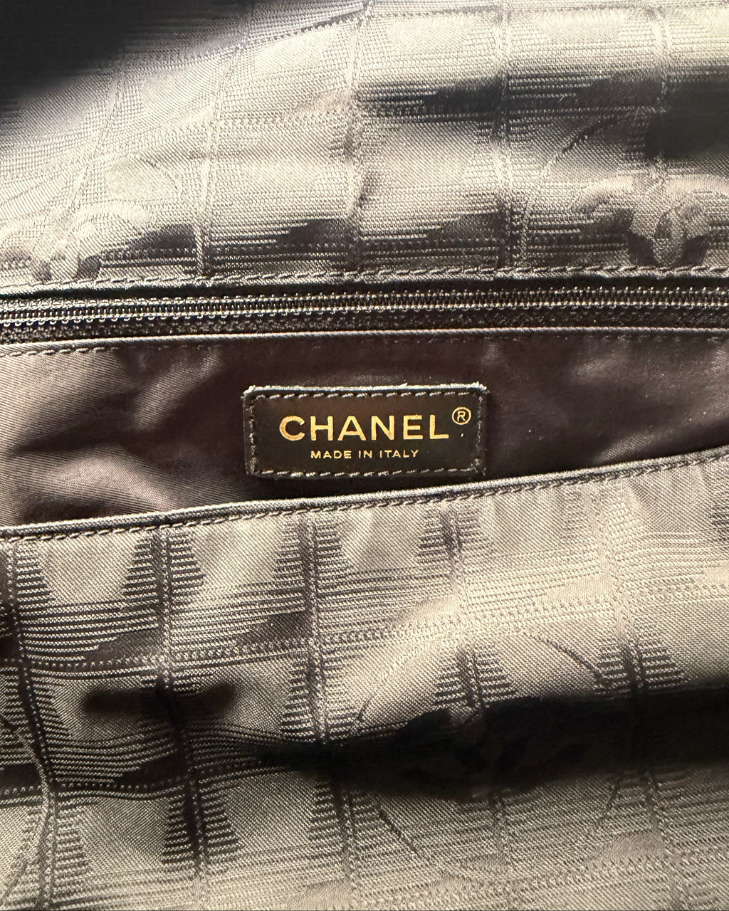 CHANEL® label on checked fabric interior of nylon messenger bag