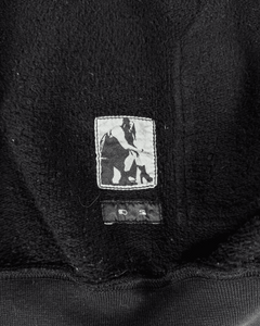 Dark hoodie chest patch with small horse graphic and outerwear label details