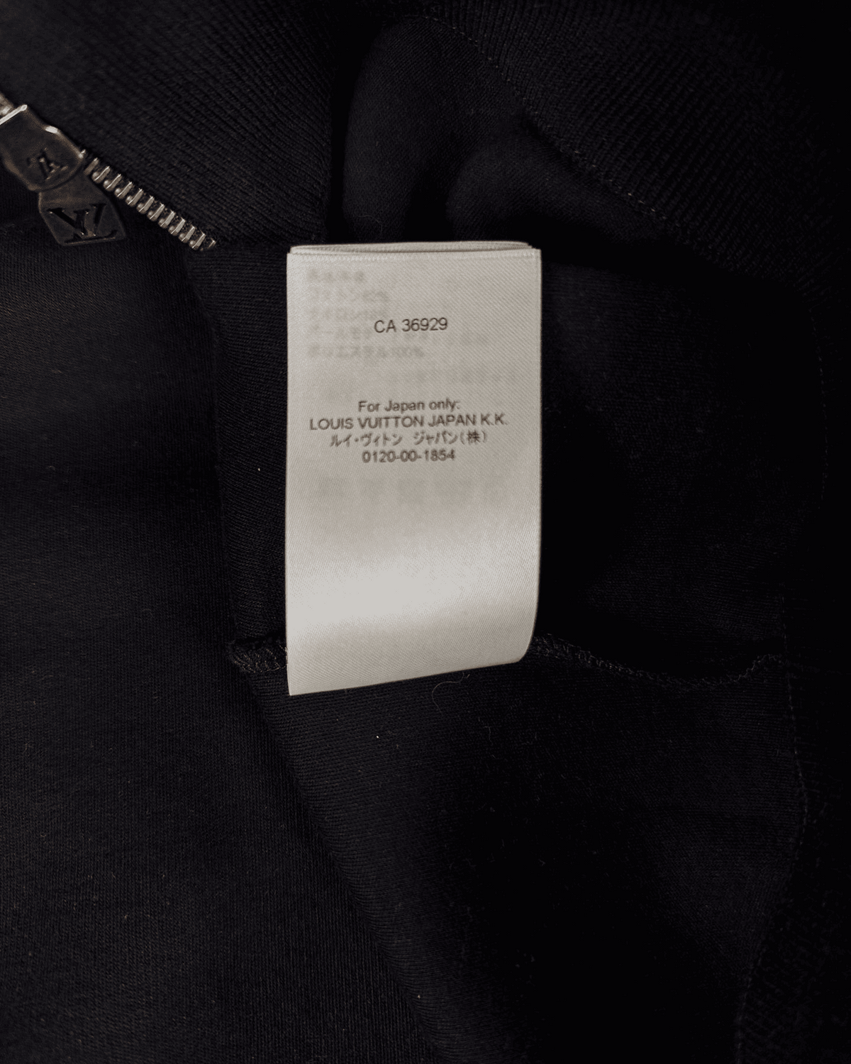 Size and origin label inside black hoodie