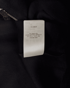 Size and origin label inside black hoodie
