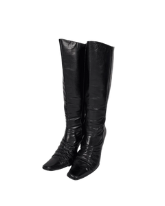 Black leather knee-high boots, pull-on style with stacked heel