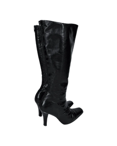 Black leather knee-high boots with side stitching and low stacked heel