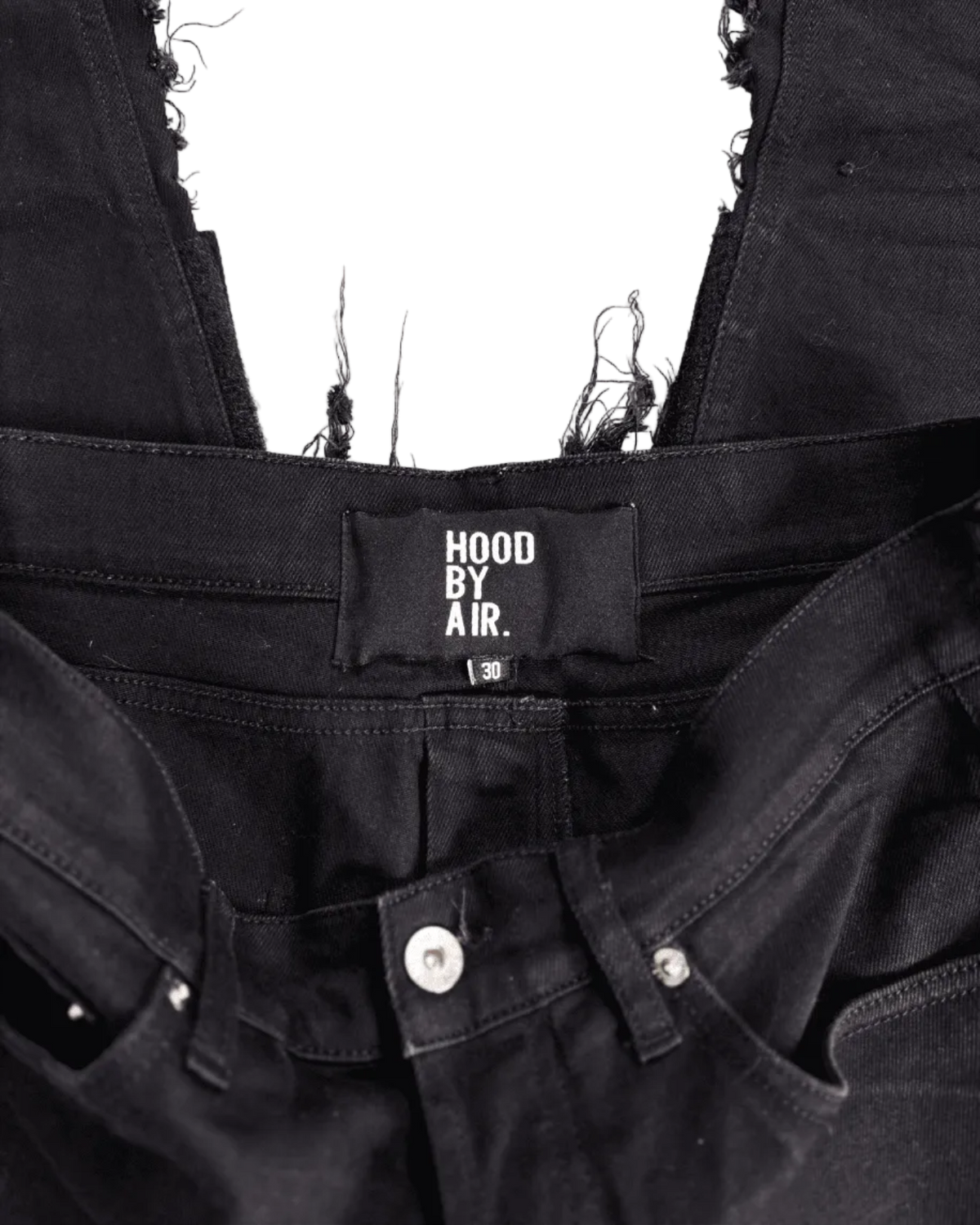 Distressed black denim jeans with HOOD BY AIR waistband tag and knee patch detailing
