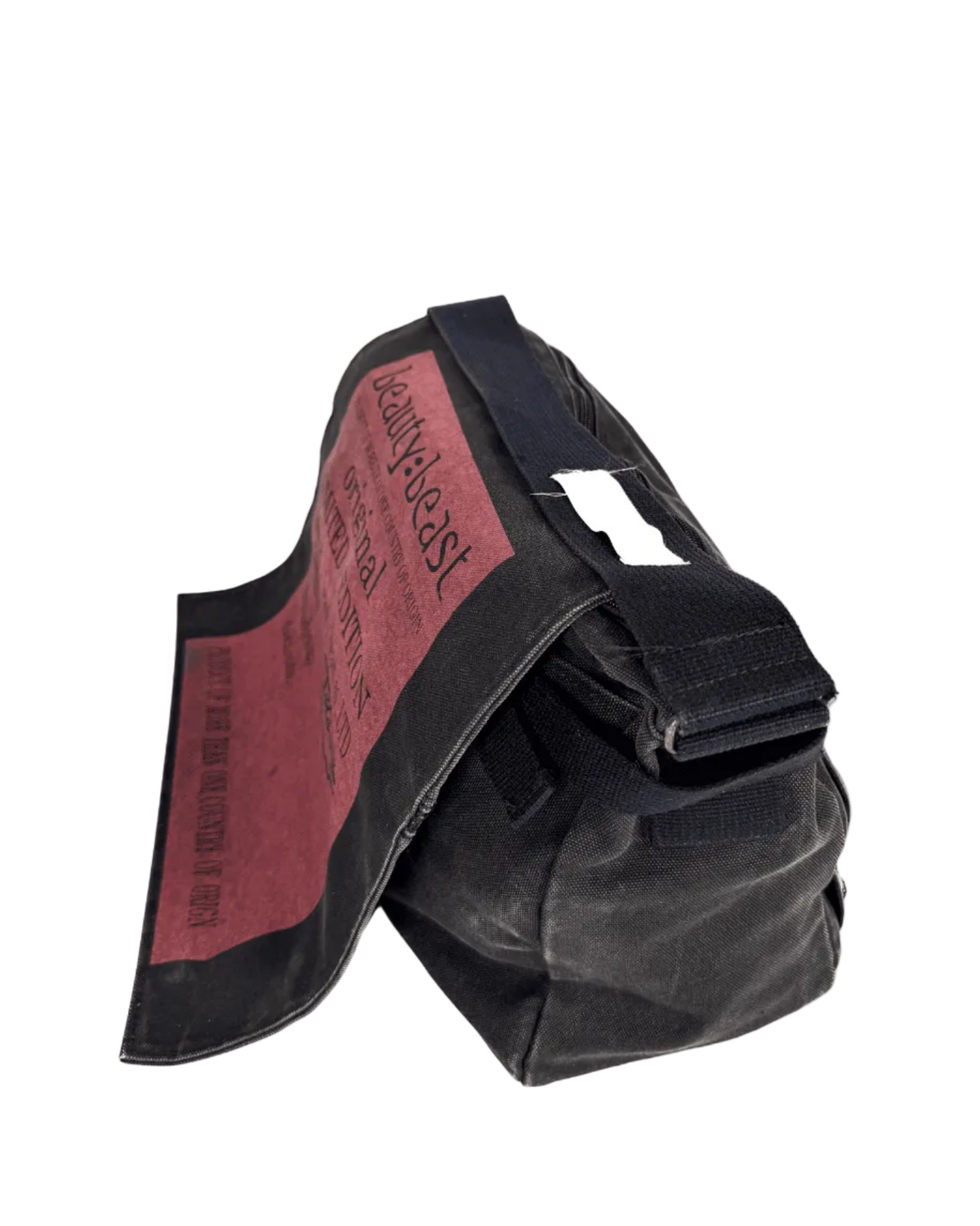 Black messenger bag with maroon fabric panel and side strap
