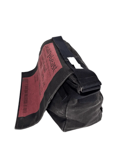 Black messenger bag with maroon fabric panel and side strap