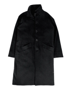 Dark wool trench coat, front view, buttoned placket, flap pockets, structured collar