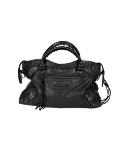 Black leather satchel with top handle, front organizer pocket, and side tassel cords