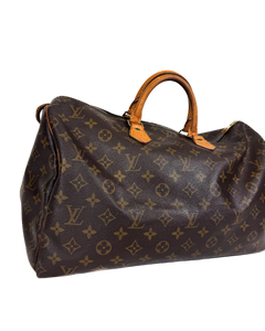 Louis Vuitton monogram duffle bag with tan leather top handles and side pocket