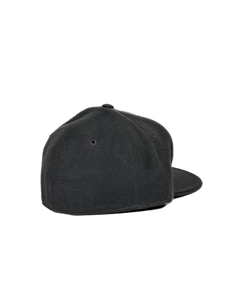 Dark grey fitted baseball cap, side view, curved brim and eyelet vents