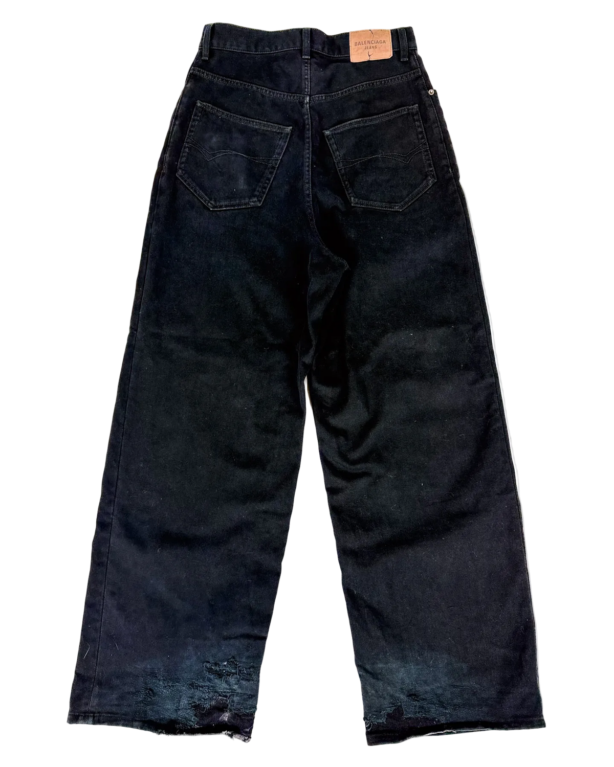 Oversized dark denim jeans with front pockets and wide straight leg.