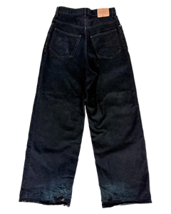 Oversized dark denim jeans with front pockets and wide straight leg.