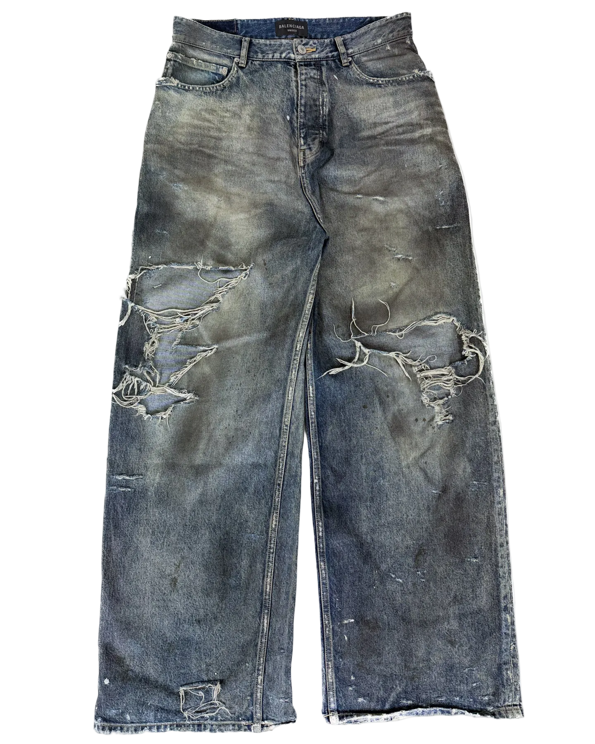 Distressed blue denim jeans with oil-splatter wash and large ripped patches