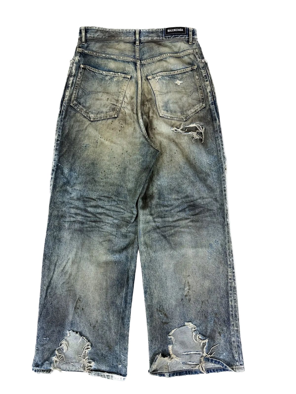 Washed blue denim jeans with distressed rips and stitched hems