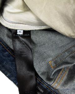 Blue denim jeans with BALENCIAGA care label and brand tag near side seam