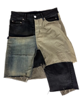Layered patchwork denim skirt in black, beige, and light blue with frayed raw hem