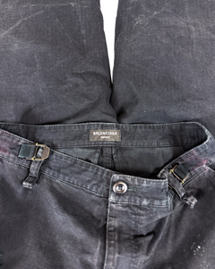 Distressed cargo pants, dark gray waistband with buckle loops and button front