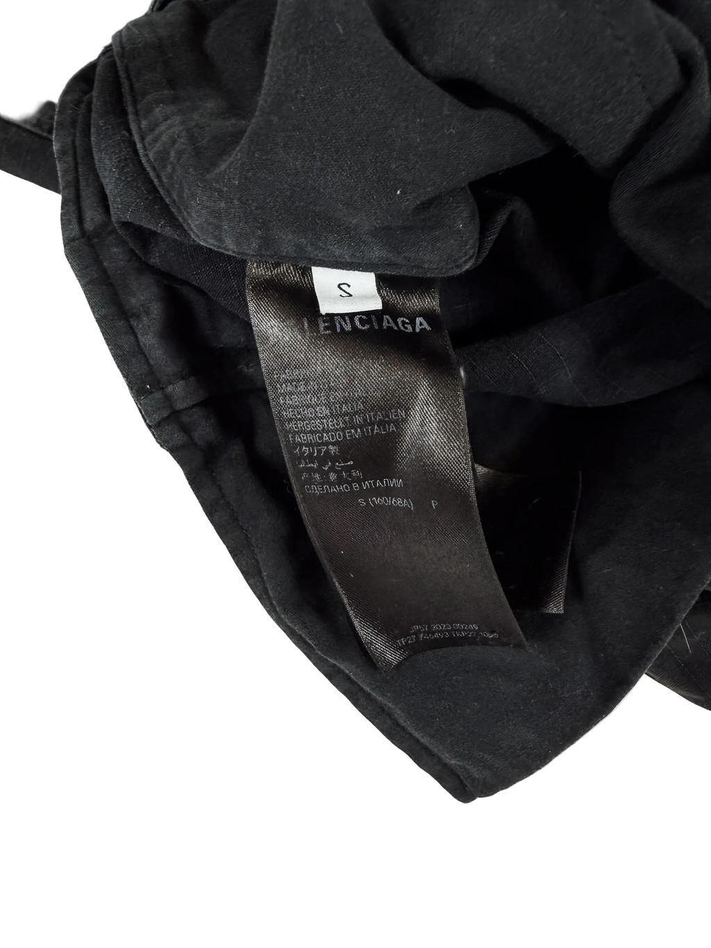 Distressed cargo pants, dark gray interior label near waistband