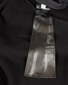 Balenciaga hoodie fabric close-up with size label tag near neckline