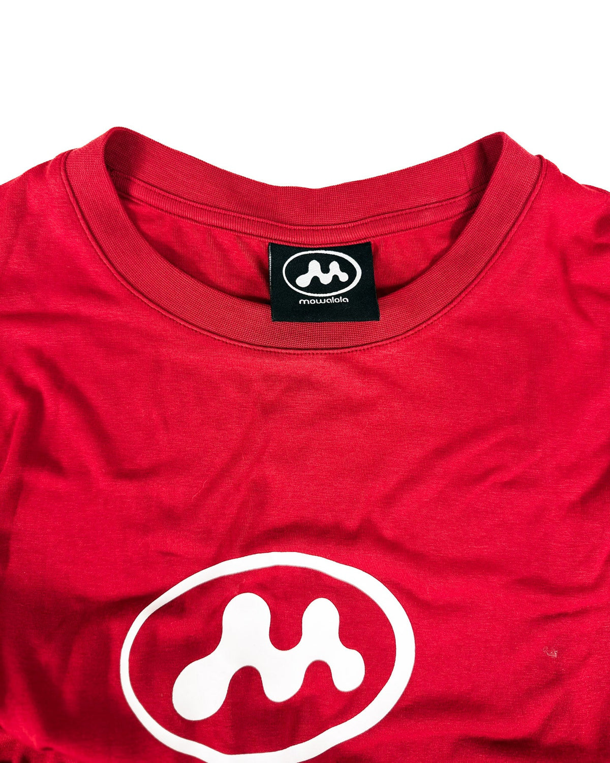 Red T-shirt dress close-up: chest oval logo and round neck with brand tag