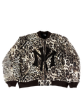Cheetah-print bomber jacket with black ribbed collar, cuffs, and full zip front